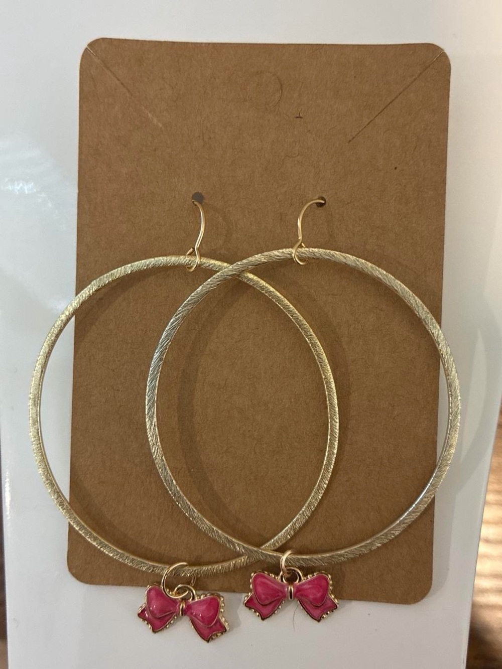 Gold Hoop Earrings with Pink Bow Charms by